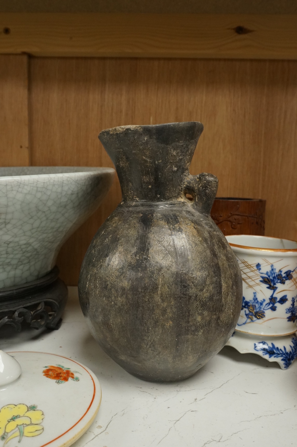 Oriental items to include a crackleglaze bowl on stand and a bamboo brush pot, together with two other vessels, largest 27cm in diameter